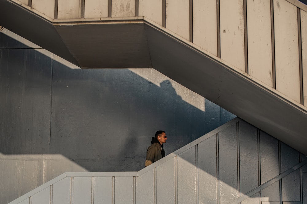 a man walking up a flight of stairs