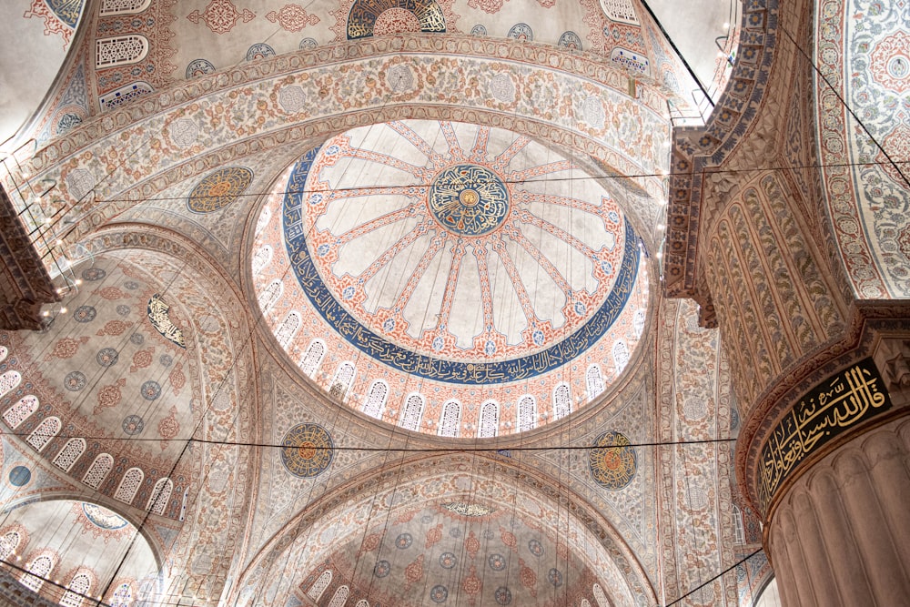 the ceiling of a large building with a dome