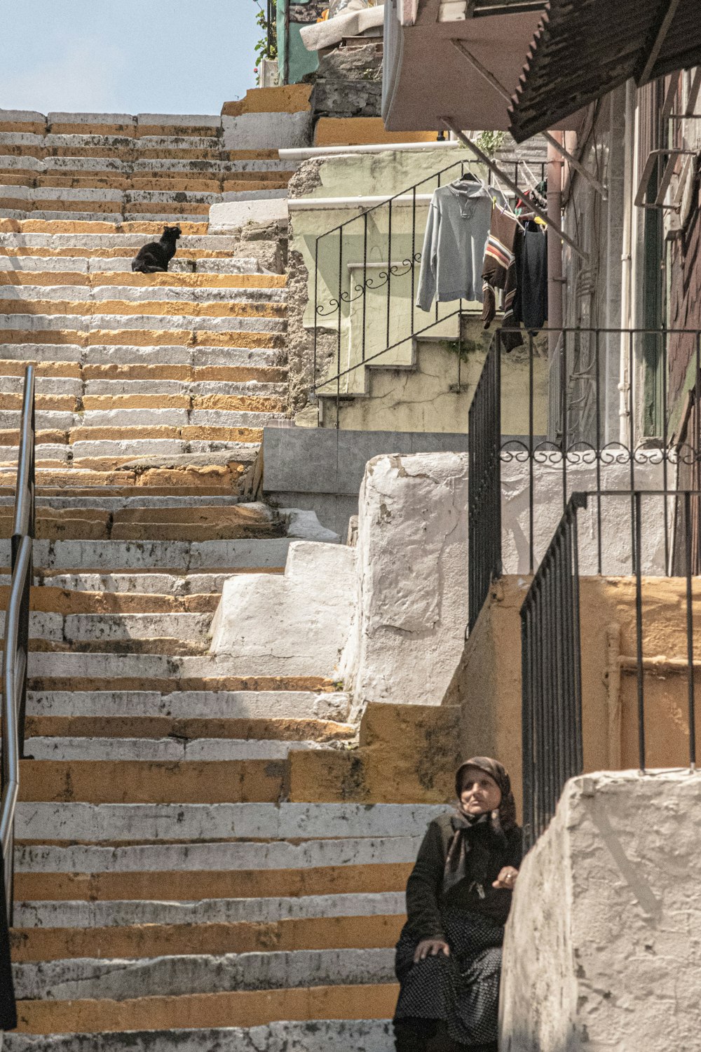 a person sitting on a set of stairs
