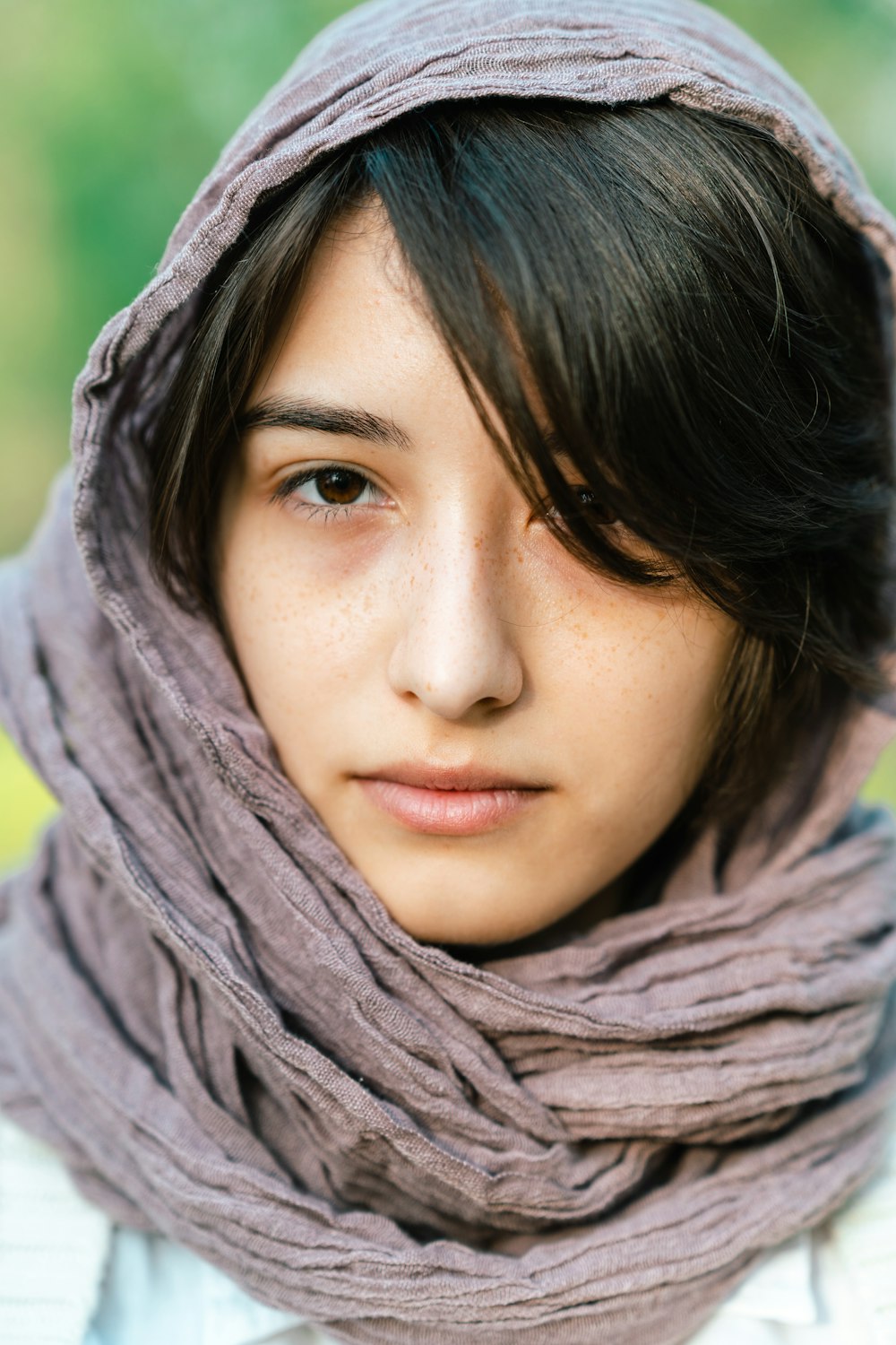 a woman with a scarf around her head