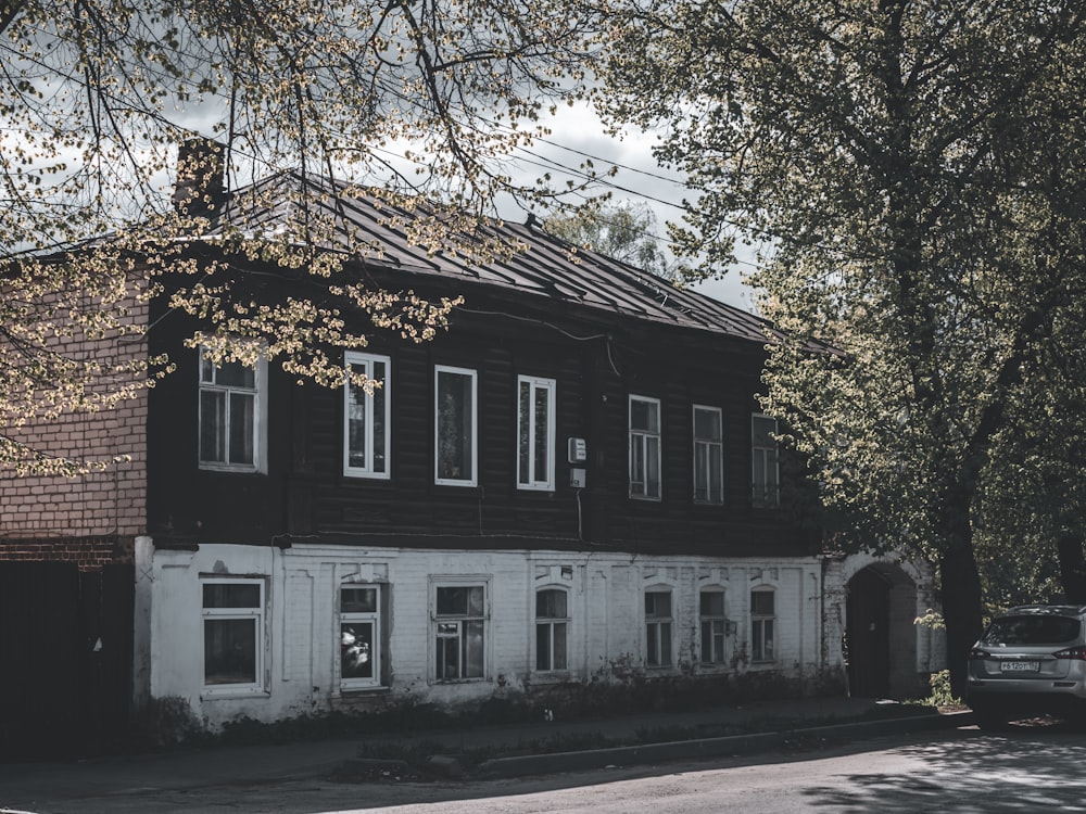 a black and white photo of an old house