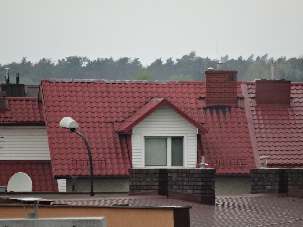 a row of houses with red roof tiles