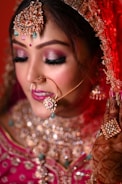 a woman in a bridal outfit with a nose ring