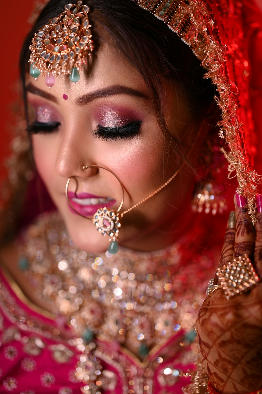 a woman in a bridal outfit with a nose ring
