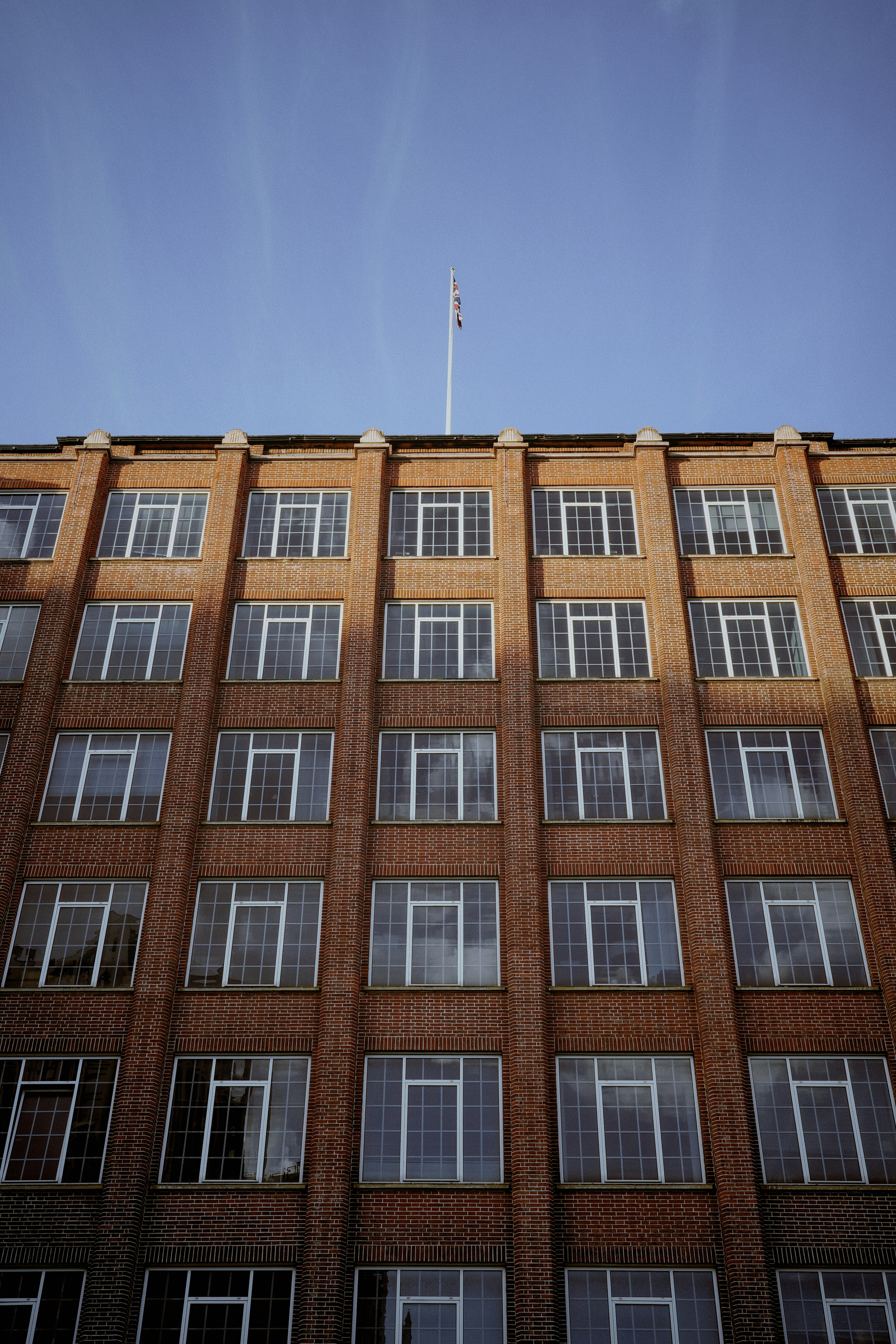 a tall brick building with lots of windows