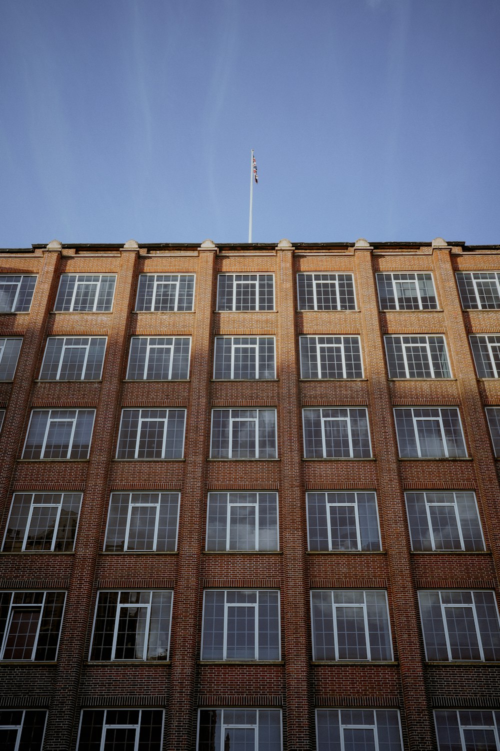 a tall brick building with lots of windows