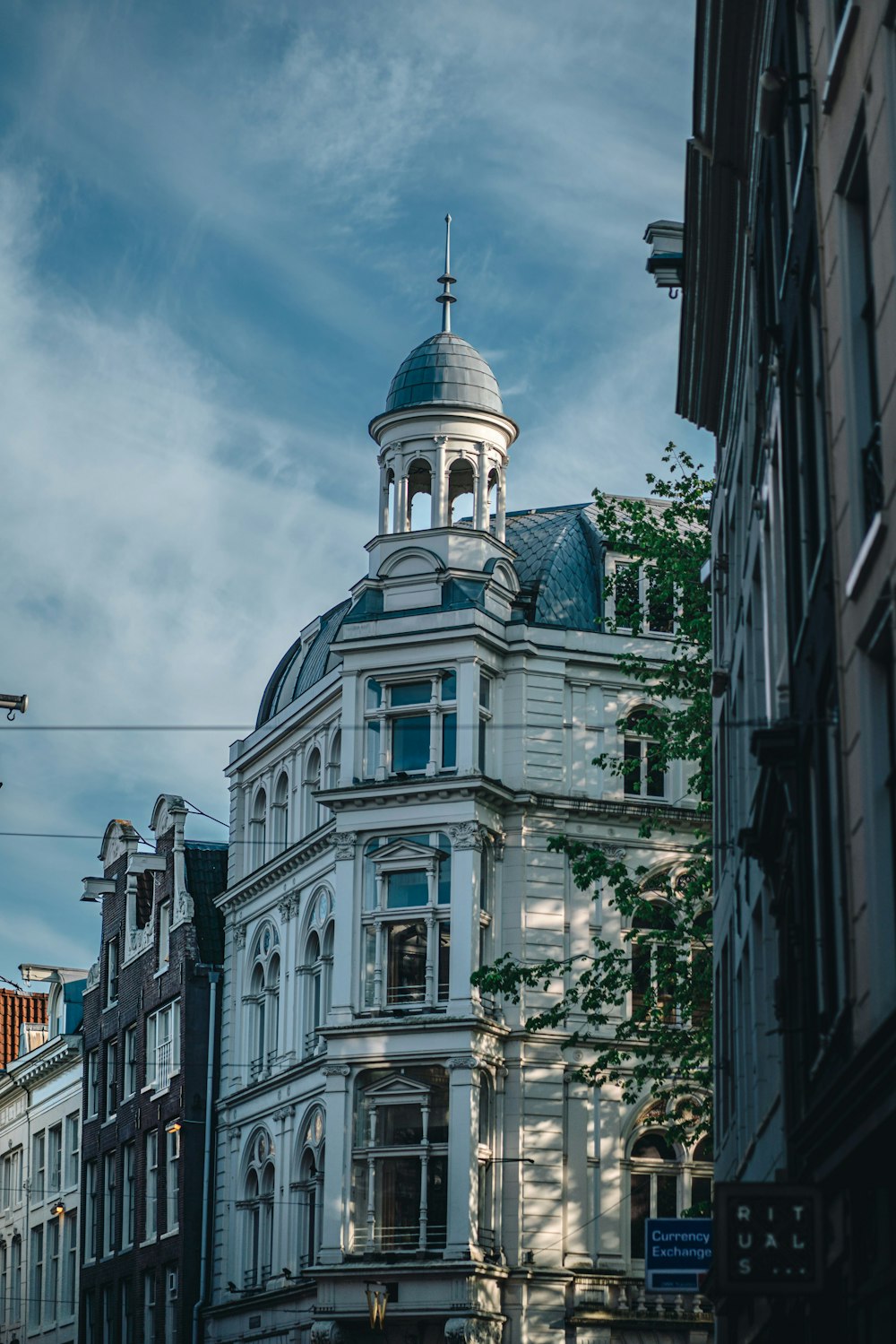 a large white building with a dome on top