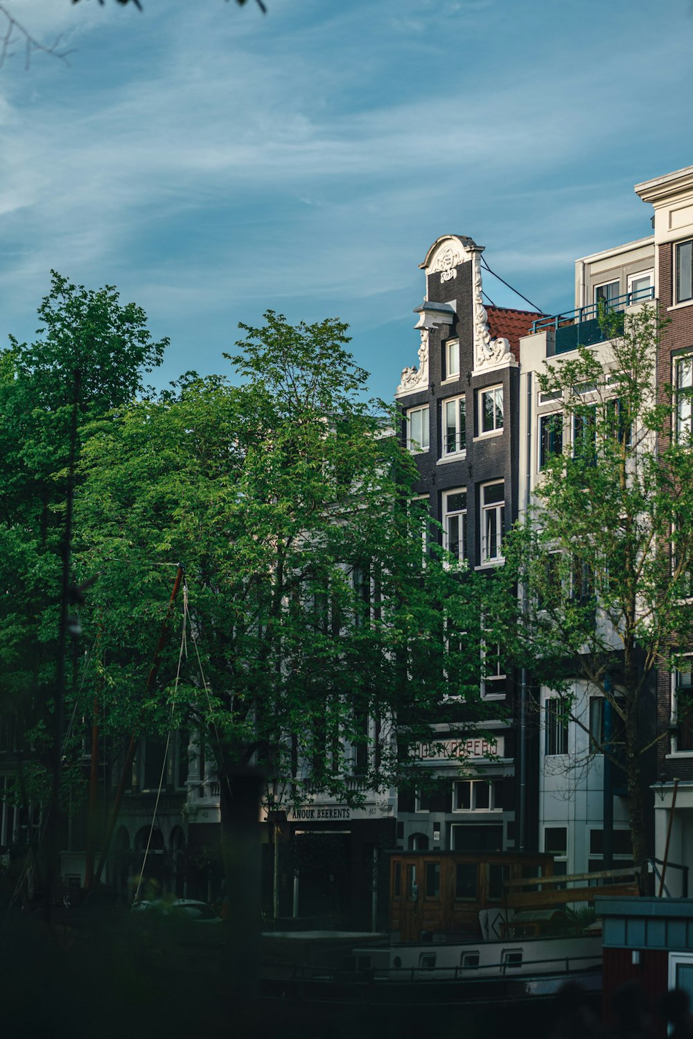 a row of buildings next to a body of water