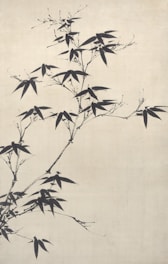 A delicate brush painting of bamboo with flowing calligraphy on rice paper.