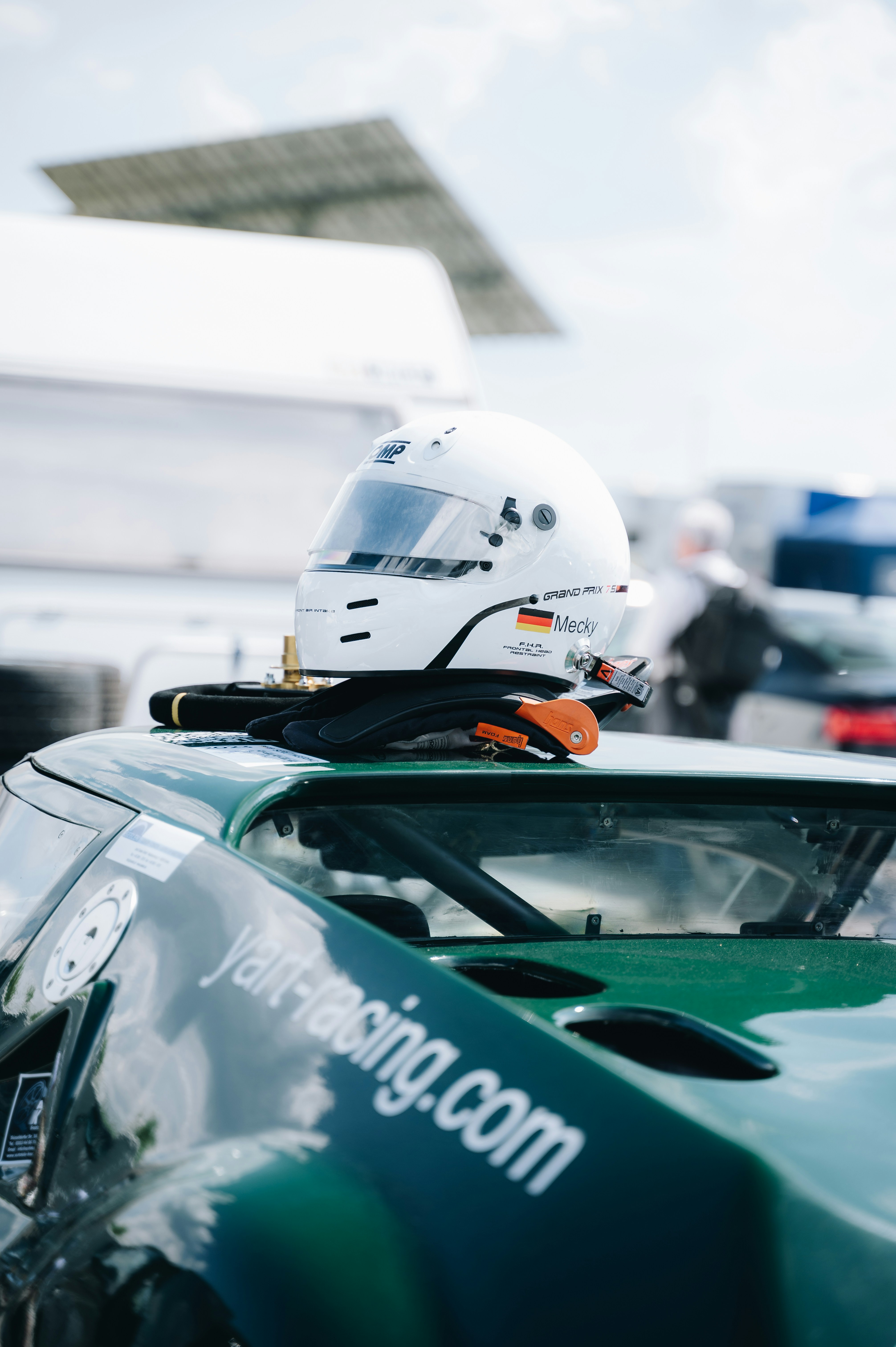 a helmet sitting on top of a green car