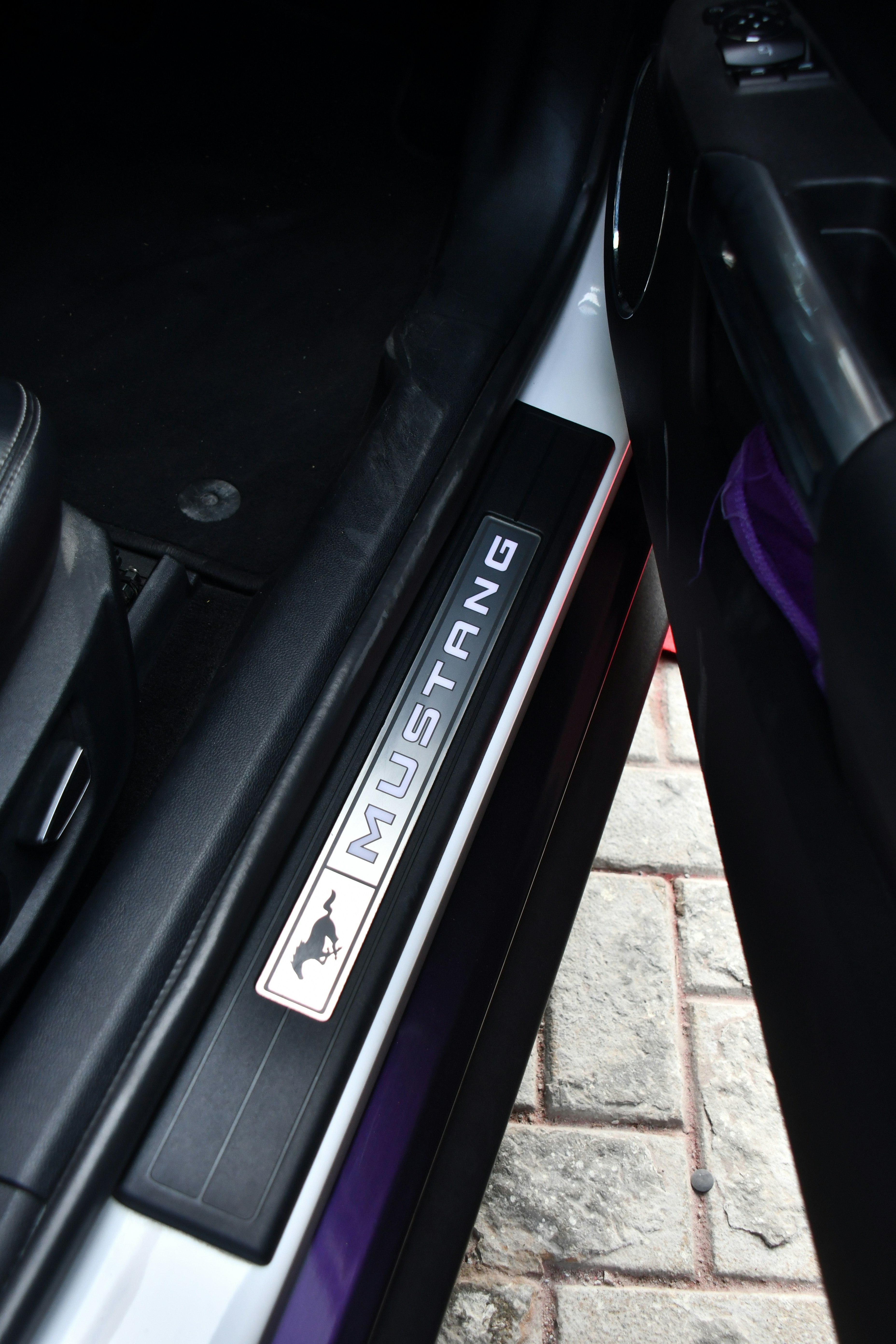 a close up of a car door with a sticker on it