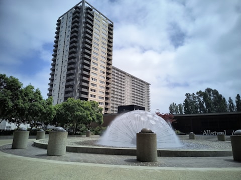Close-up of a stylish apartment balcony overlooking Dubai Fountain.