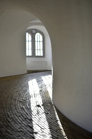 A serene hospital corridor bathed in soft natural light, symbolizing healing and care.