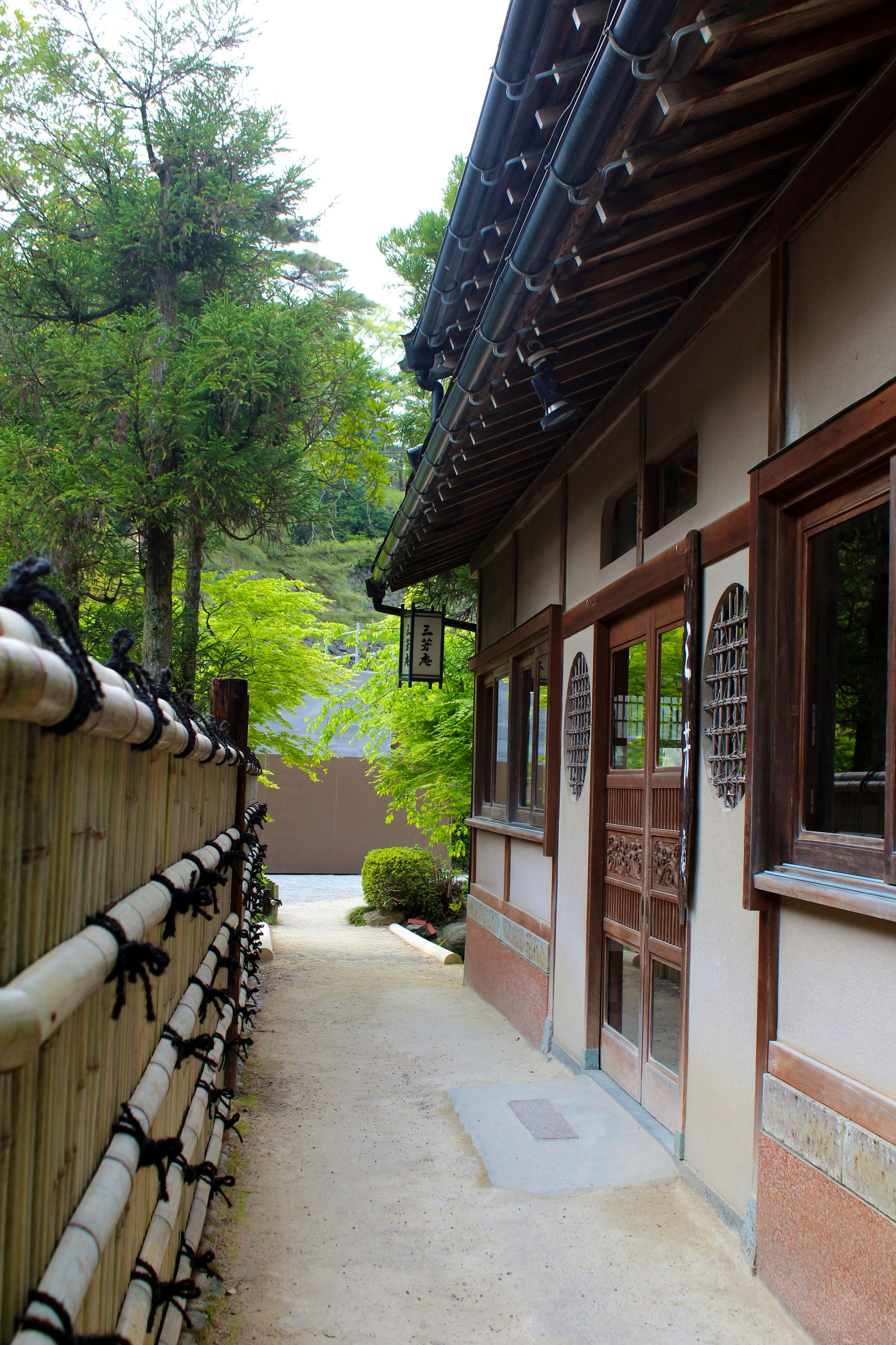 a building with a wooden fence next to it