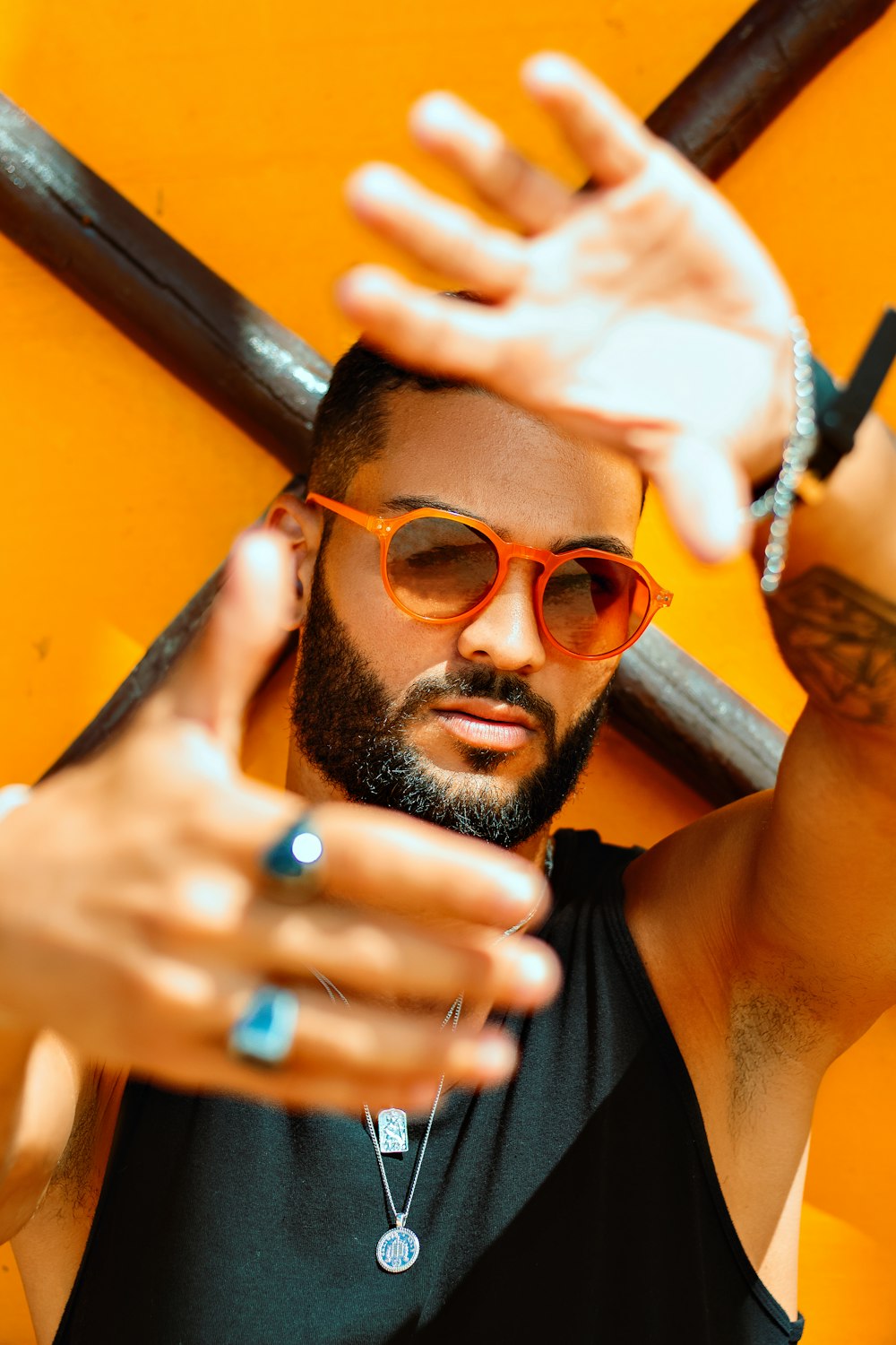 A man with a beard and sunglasses holding a baseball bat photo – Free  Fashion Image on Unsplash