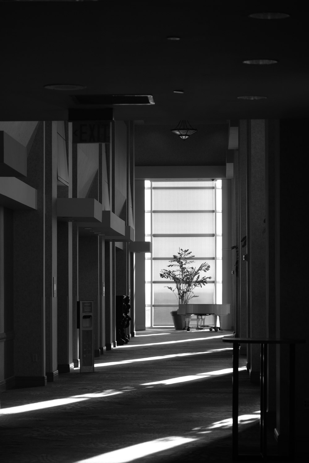 a black and white photo of a hallway