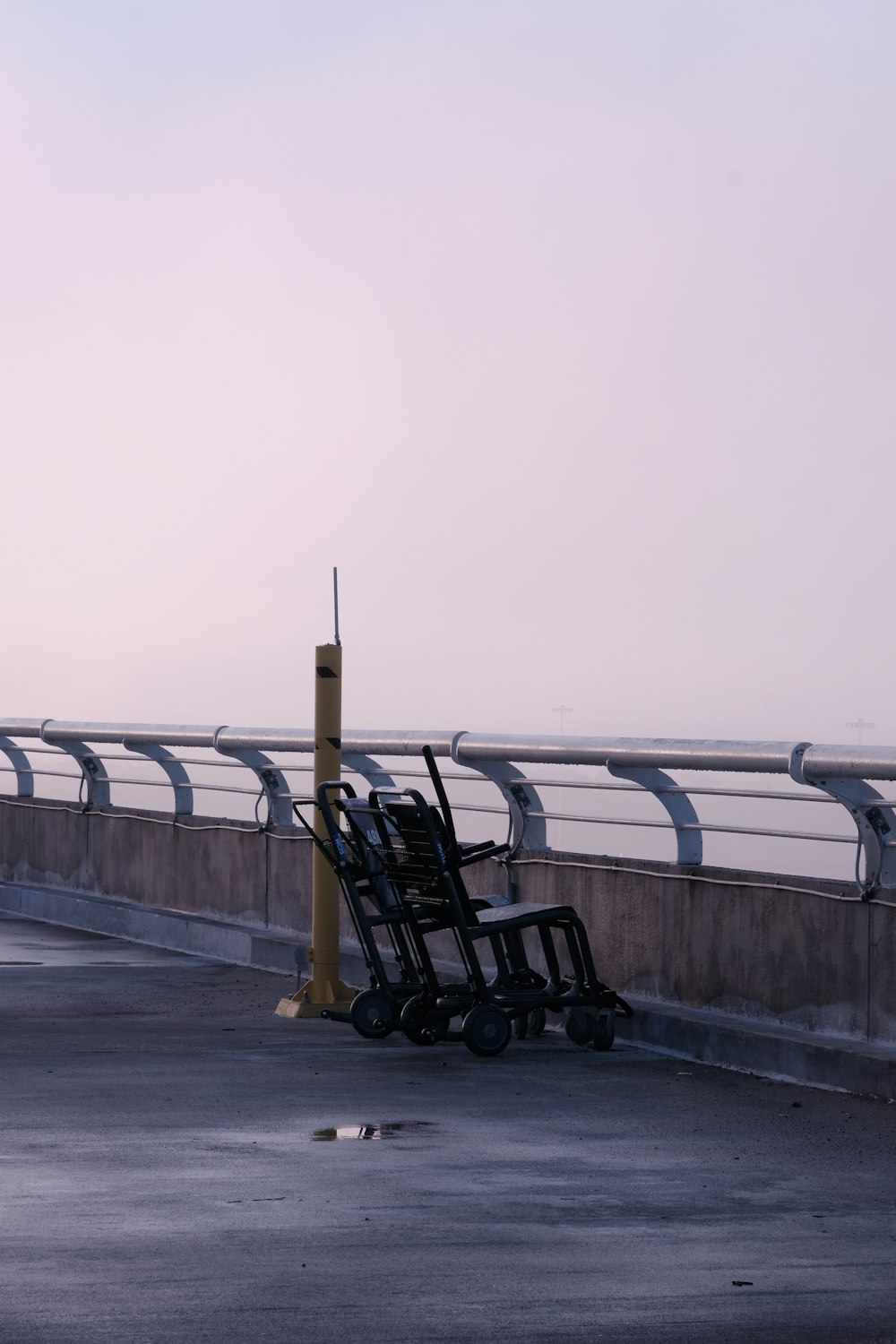 a pile of luggage sitting on the side of a road