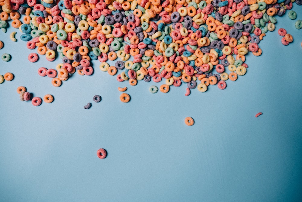 a bunch of cereal sprinkled on a blue background