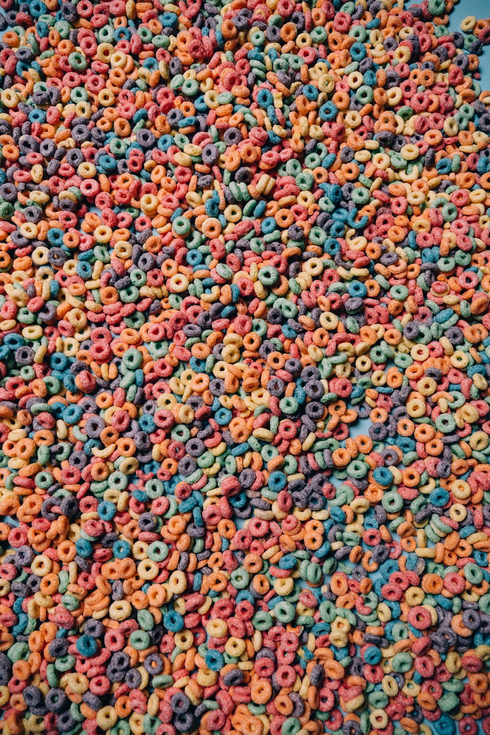 a large pile of cereal sprinkled with colored sprinkles