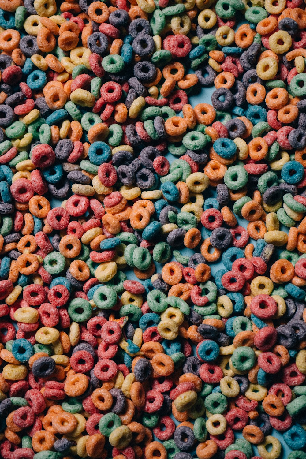 a mixture of colorful cereals and cereal rings