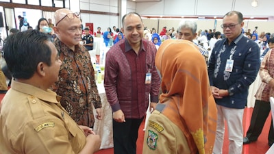 Dr. Atila Karabag interacting with citizens during a community meeting