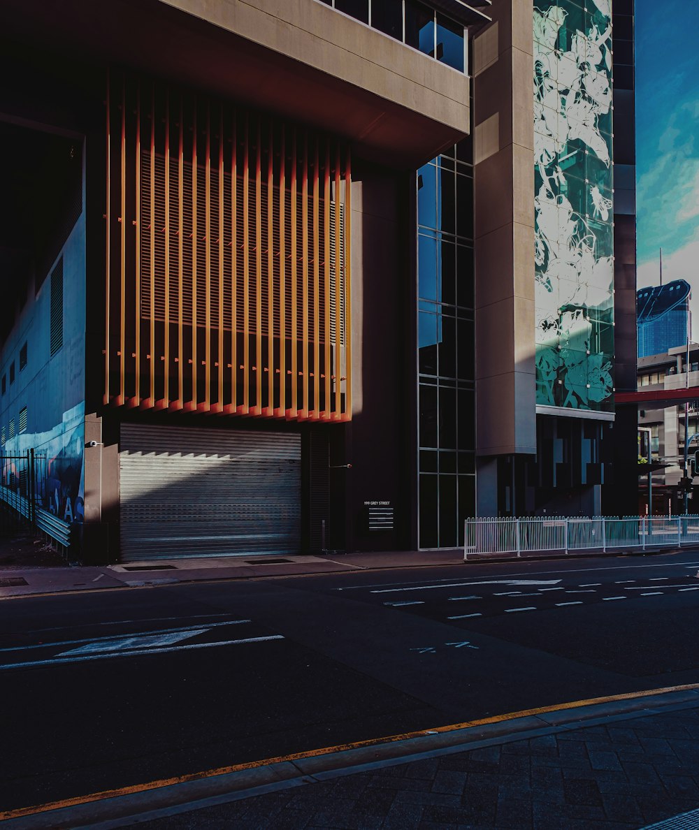 a tall building sitting on the side of a road