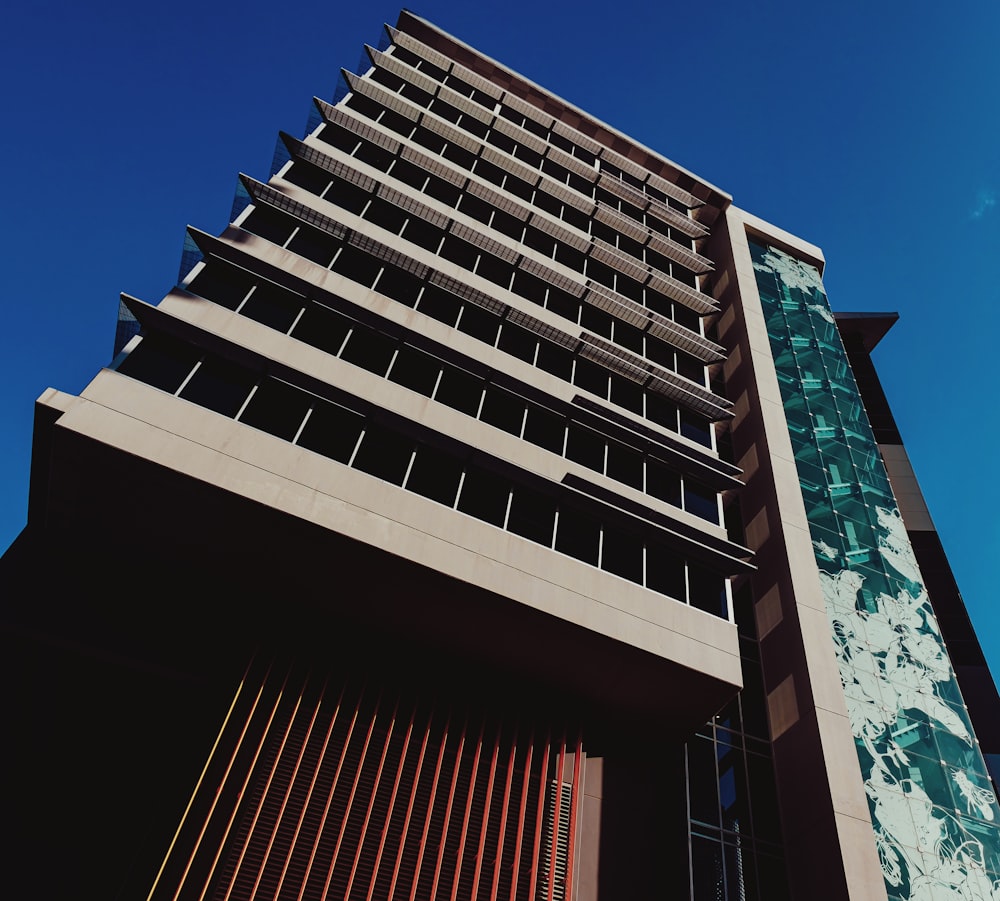 a tall building with a sky background