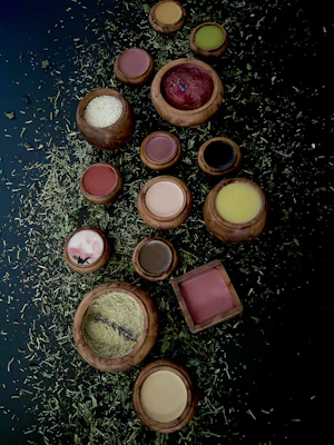 Close-up of vibrant herbal powders in wooden bowls, showcasing natural ayurvedic ingredients.