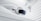 A virtual reality headset and two controllers are suspended against a backdrop of smooth, swirling white fabric, evoking a sense of fluidity and modern technology.