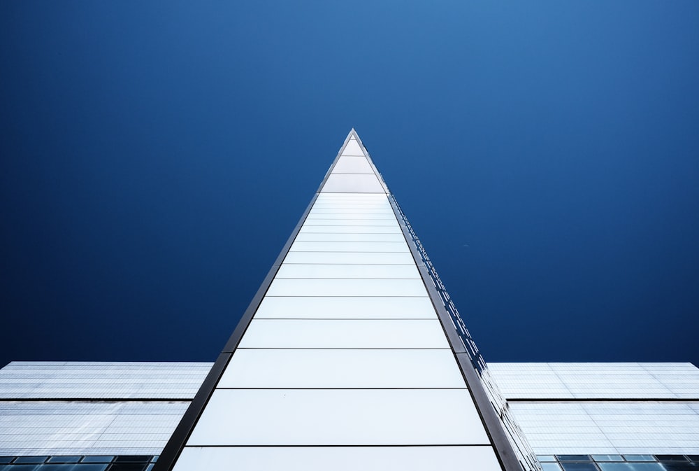 a very tall building with a sky background