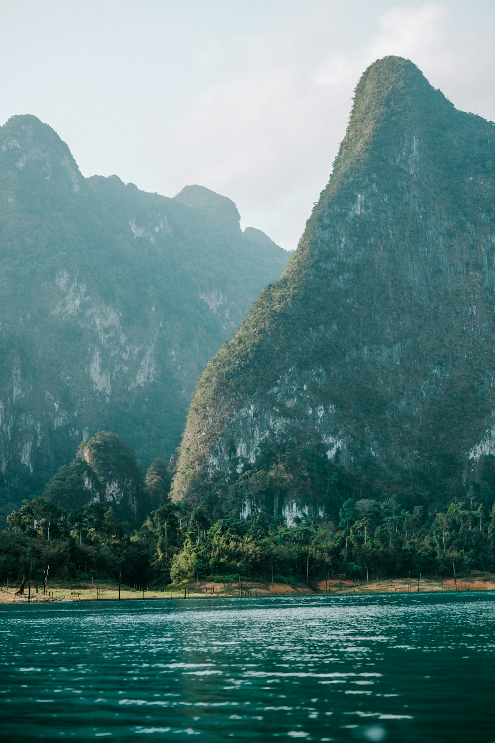 a mountain range with a body of water in front of it