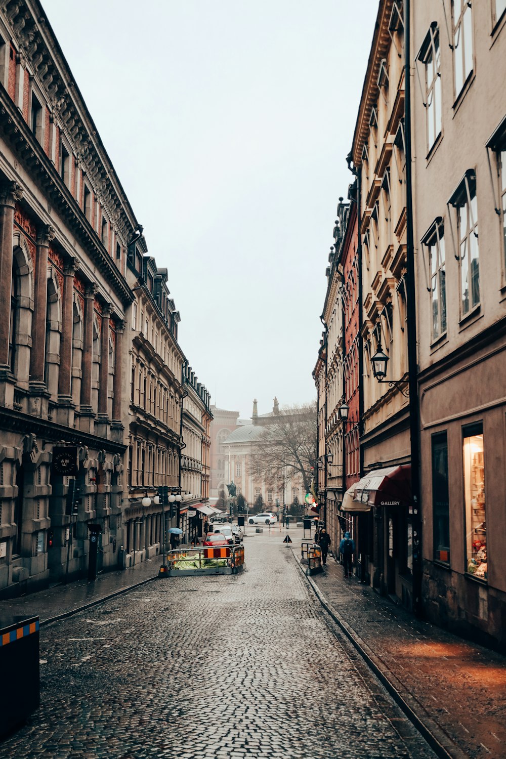 a cobblestone street in a european city