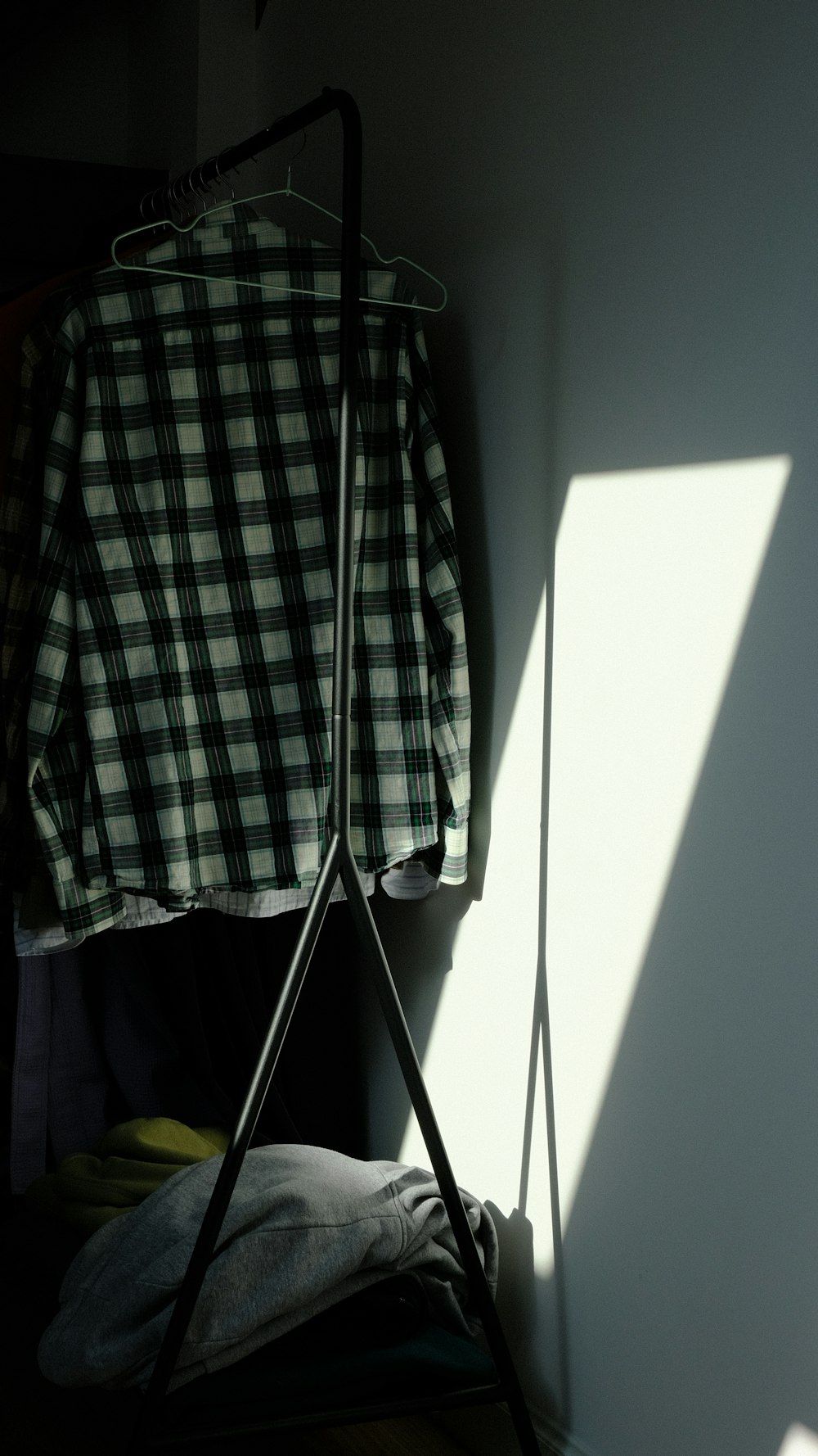 a shirt is hanging on a clothes rack