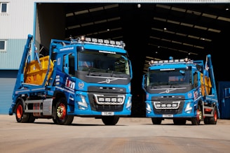 a couple of trucks parked in front of a building