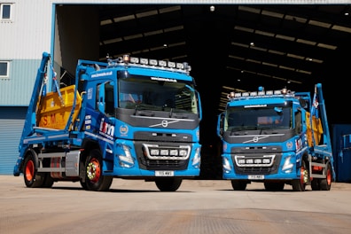 a couple of trucks parked in front of a building