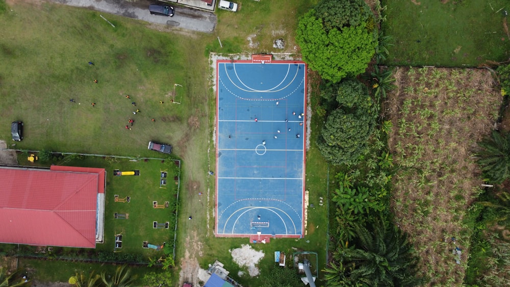 an aerial view of a basketball court in a park