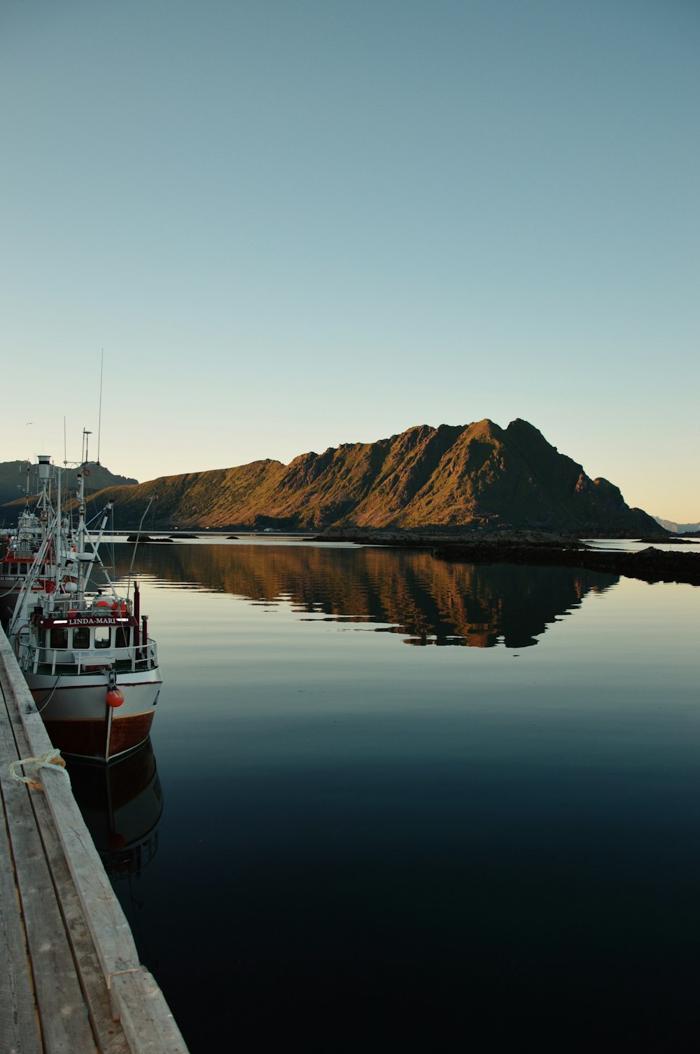 a couple of boats that are sitting in the water