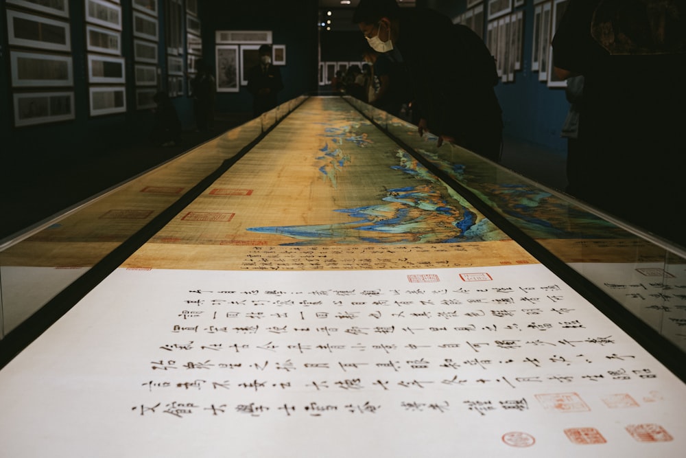 a long table with writing on it in a room