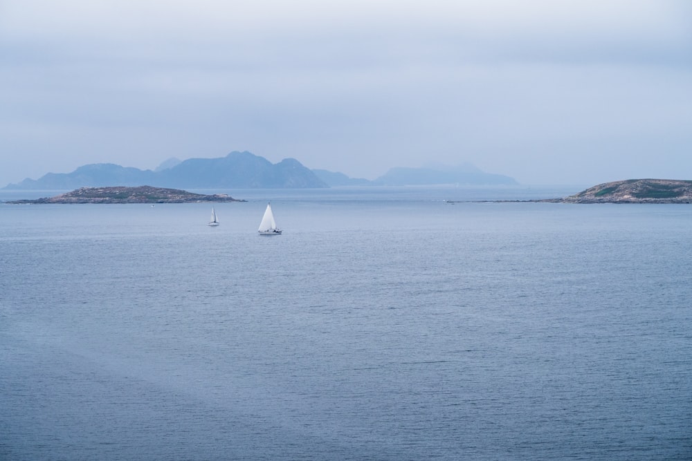 a sailboat in the middle of a large body of water