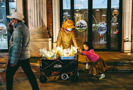 Warm and friendly scene of a caregiver assisting a senior with grocery shopping outdoors.