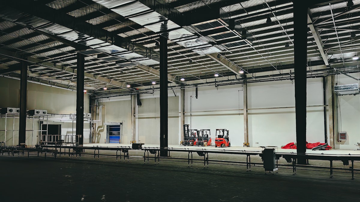 Empty warehouse interior with high clear height and natural lighting