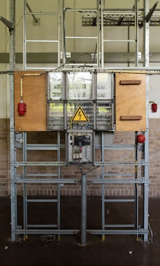 a parking meter in front of a brick wall