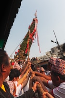 A group of volunteers setting up decorations for a local festival.