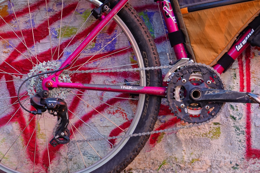 a close up of a bike parked on a sidewalk