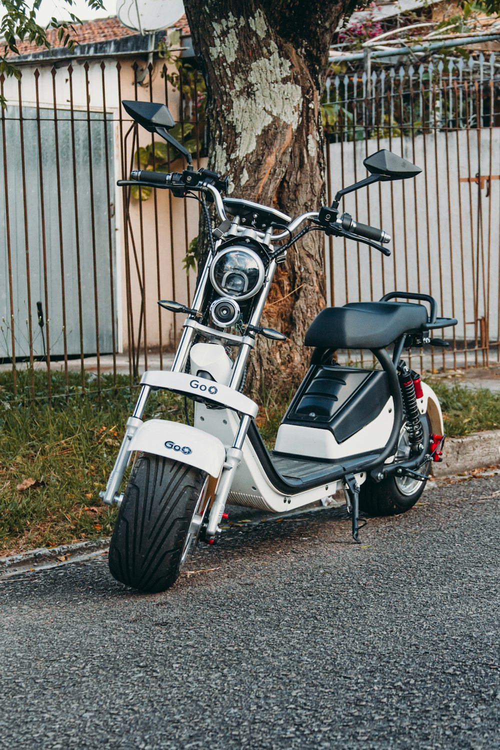 a scooter parked on the side of the road