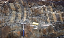 Close-up of a geophysical instrument measuring underground mineral deposits.