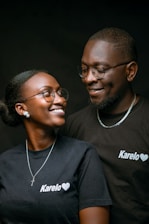 a man and a woman smiling at each other