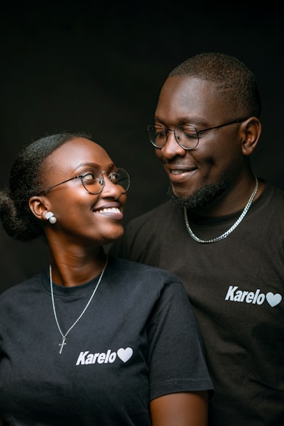 a man and a woman smiling at each other