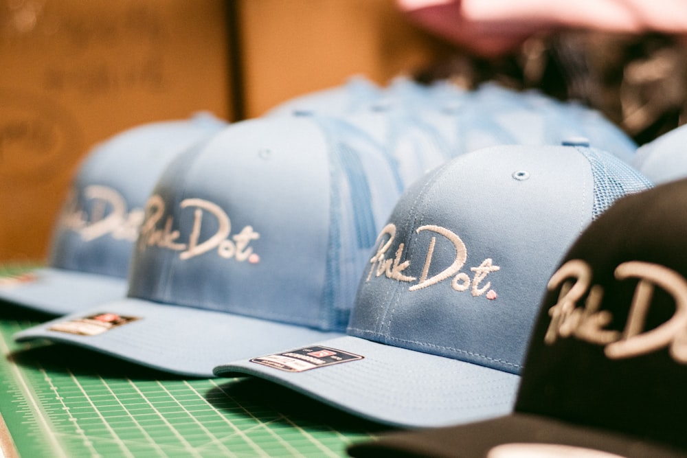 a row of hats sitting on top of a table