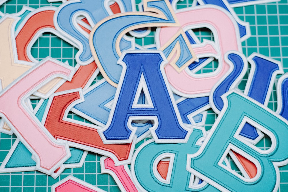 a pile of cut out letters sitting on top of a table